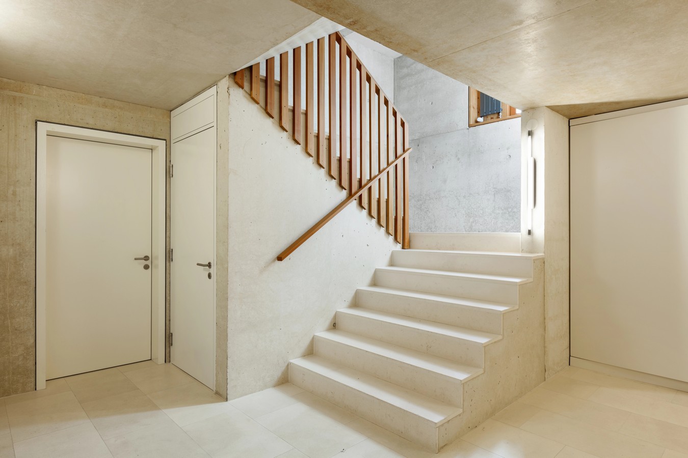 Concrete staircase with timber balustrade meeting Queensland building regulations