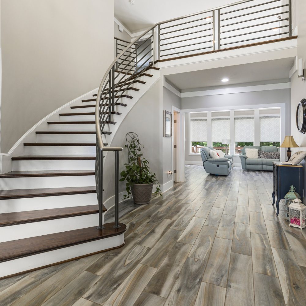 Curved internal staircase with steel balustrade in a modern Queensland home