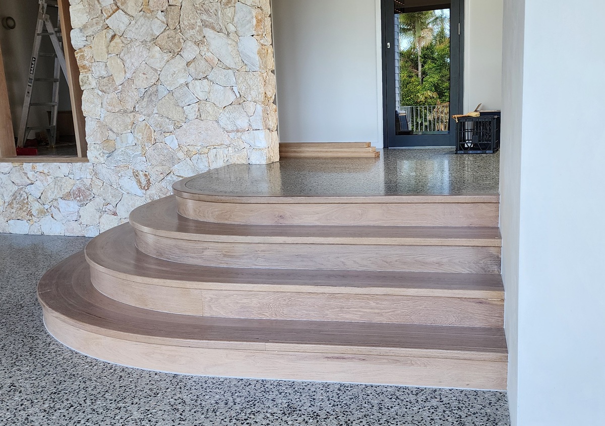 Close-up of curved timber staircase treads