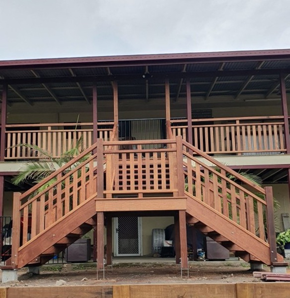 Outdoor timber stairs with wire balustrade leading to an elevated deck in Brisbane