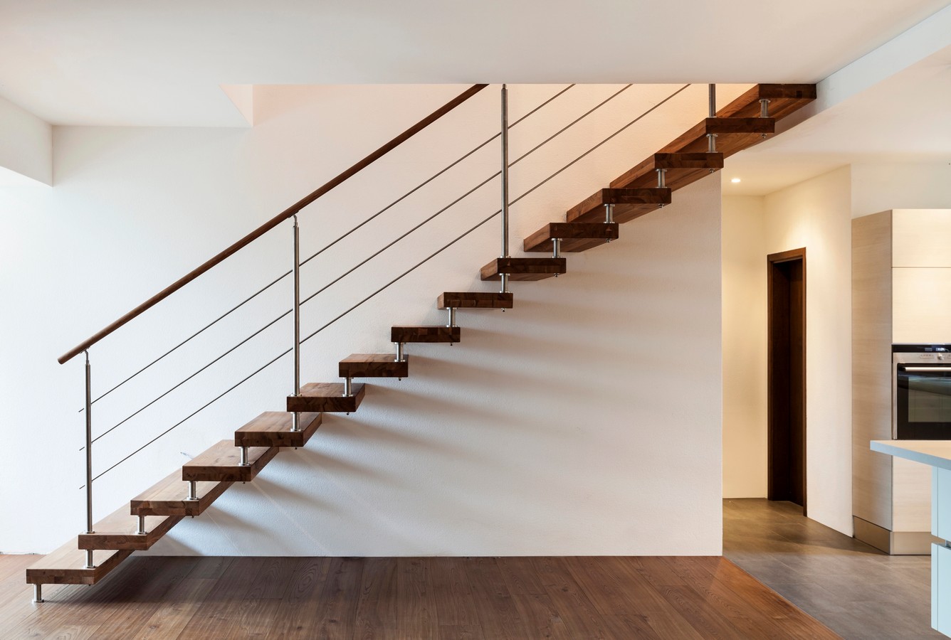 Floating timber treads on a mono stringer staircase in a modern Queensland home