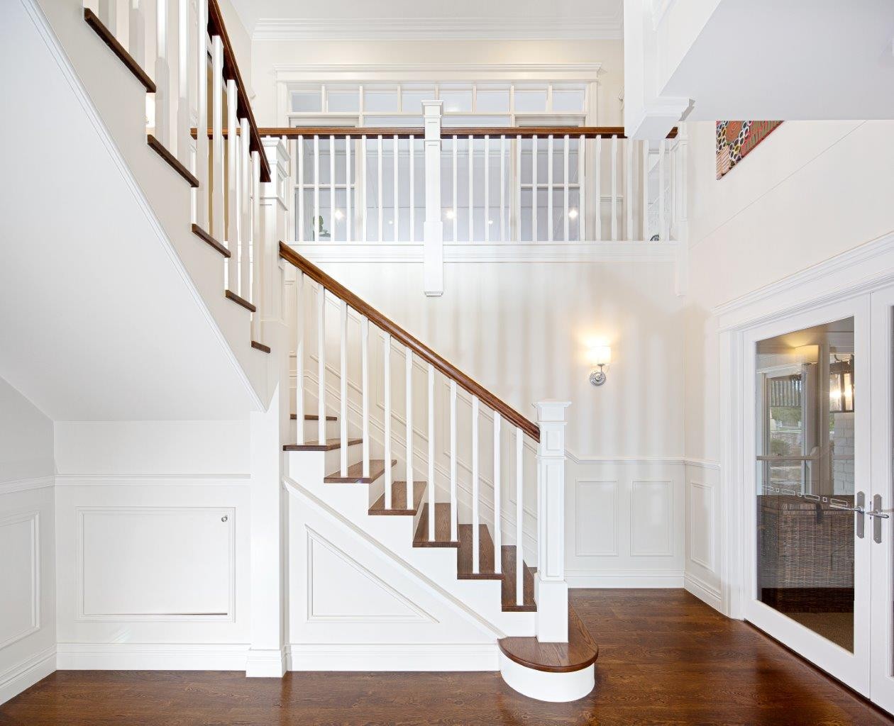 Custom house stairs with hardwood treads and timber balustrade in a Brisbane Queensland home