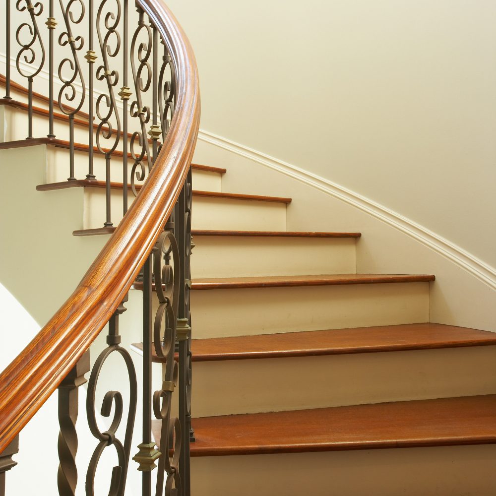 Compliant timber handrail meeting Queensland building code requirements on an internal staircase