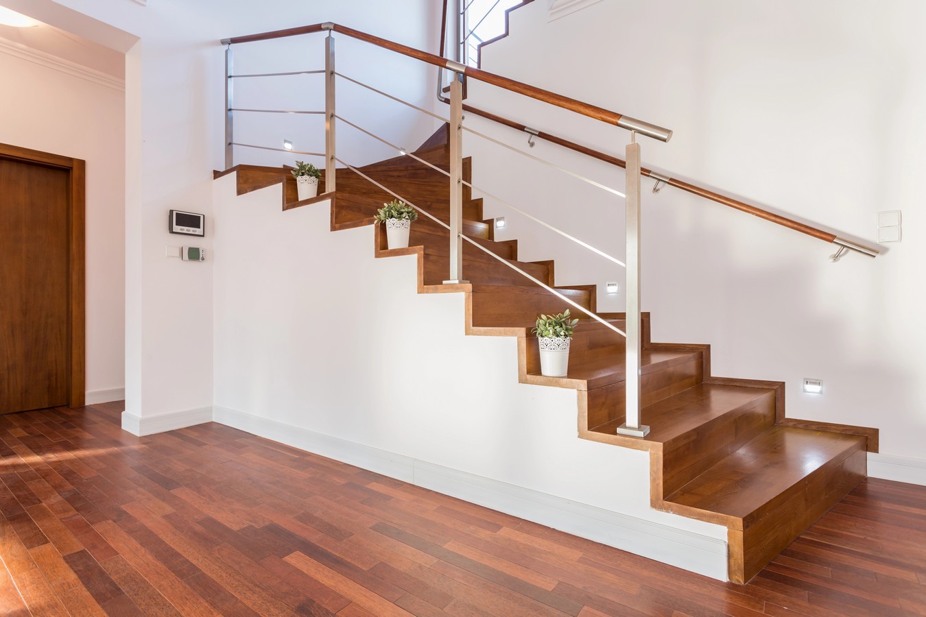 Hardwood staircase with steel rod balustrade showing quality craftsmanship