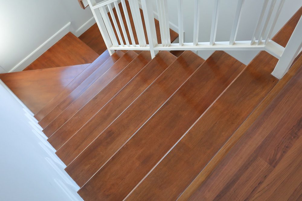Custom Australian hardwood timber staircase with natural grain finish in a Brisbane home