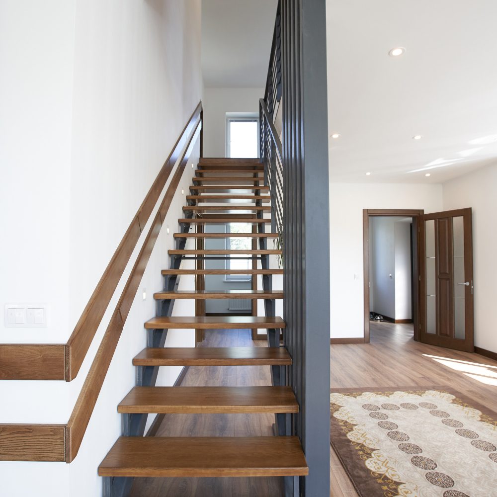 Custom house stairs with hardwood treads and timber balustrade in a Brisbane Queensland home