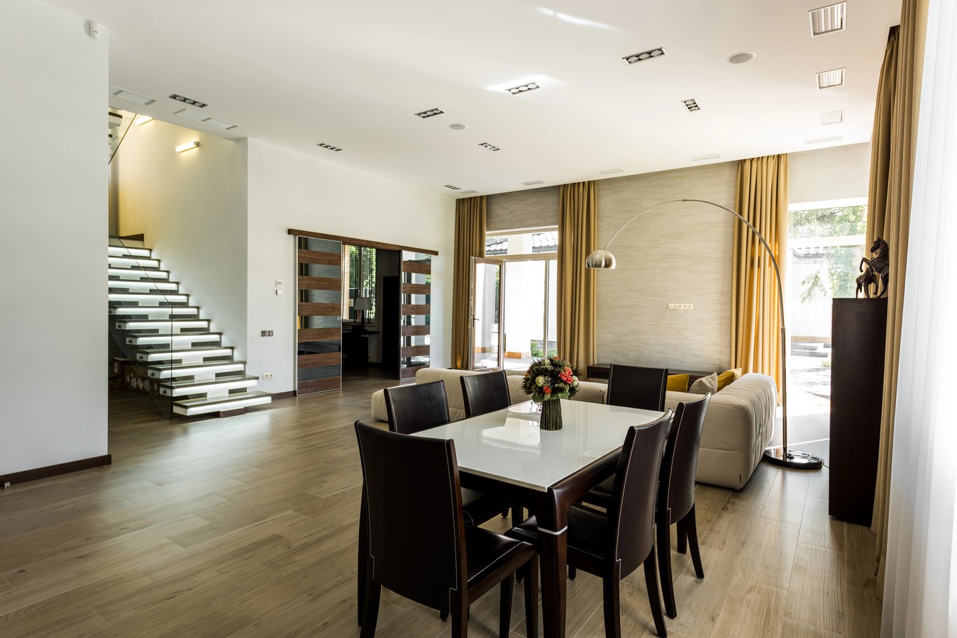 Modern floating staircase in an open-plan living area of a Brisbane home
