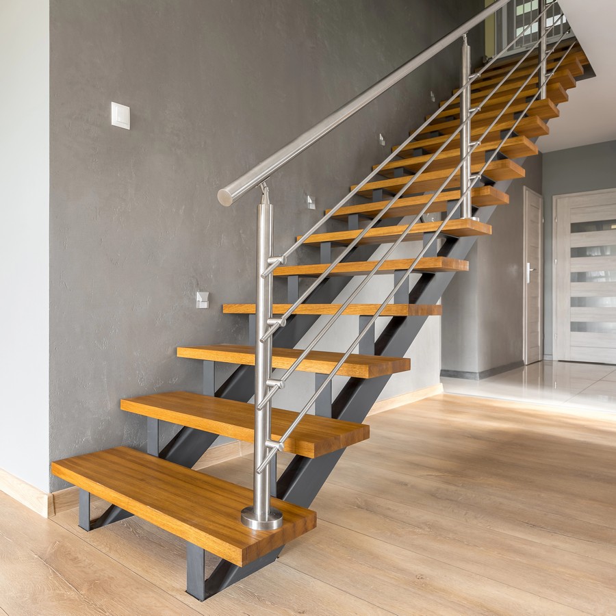 Open-tread staircase with steel stringers and timber treads showing individual risers