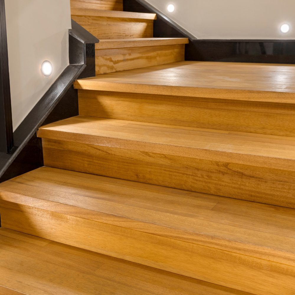 Anti-slip nosing strip installed on timber staircase treads for safety compliance in Queensland