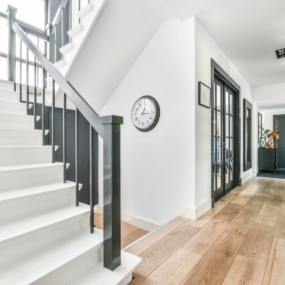 Homeowner reviewing staircase design options with custom timber and steel samples in Brisbane