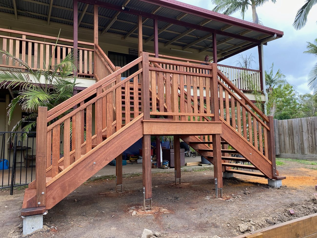 U-shaped hardwood external staircase with landing platform on a Queensland home
