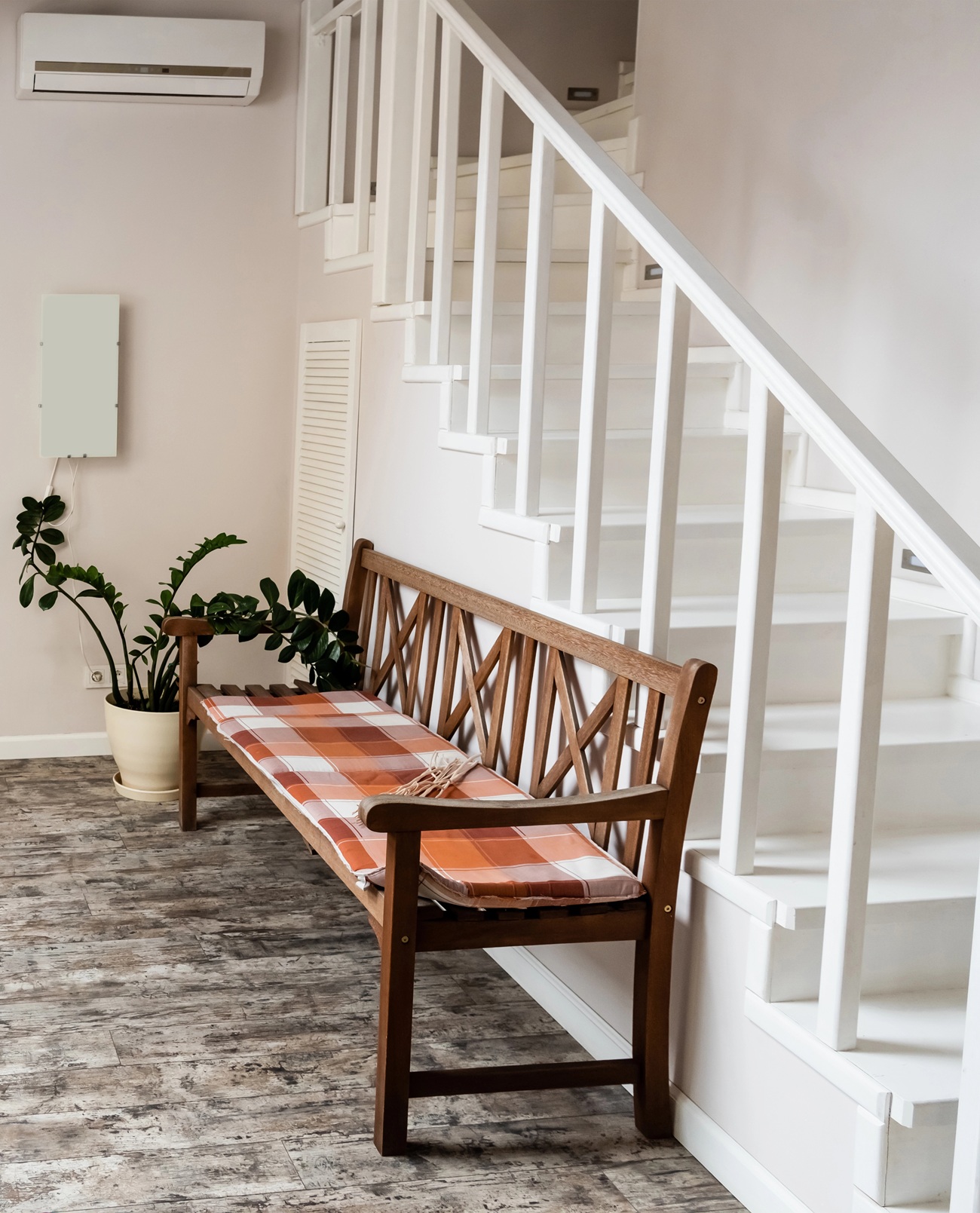 White interior staircase with timber bench seat in a modern Australian home
